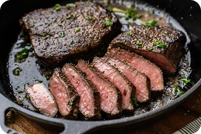 Steak searing in a cast-iron skillet