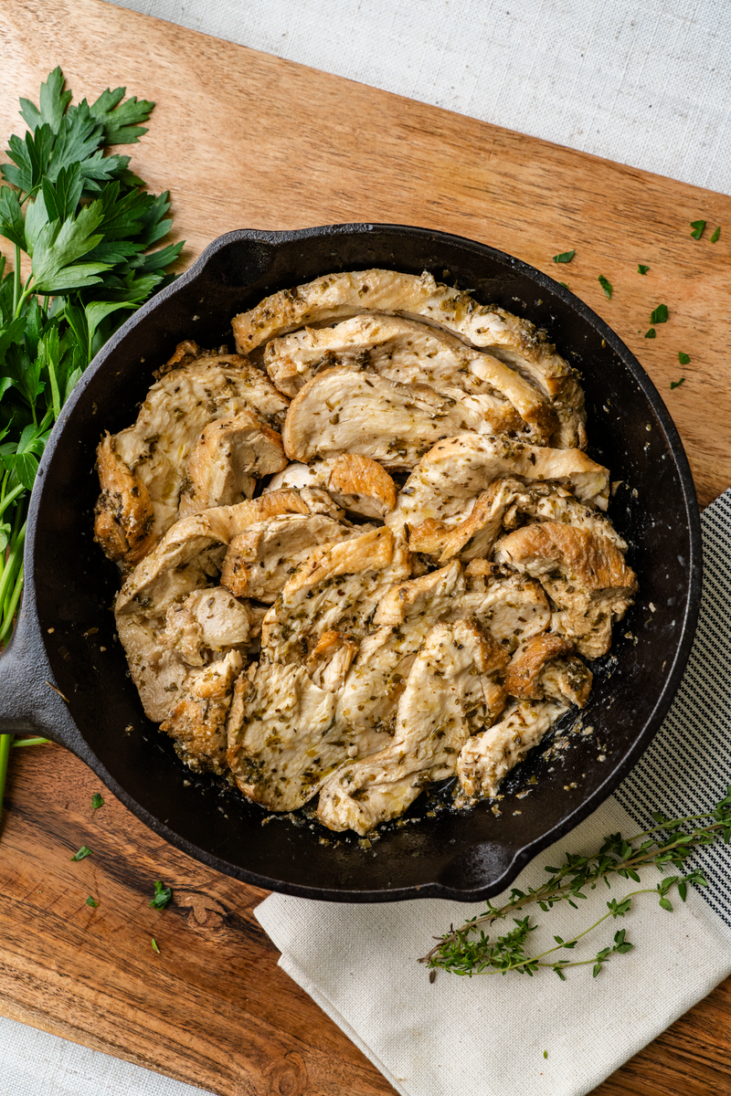 Mediterranean Chicken in a cast-iron skillet