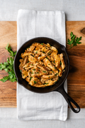 Pollo Asado Chicken in a cast-iron skillet