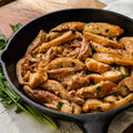 Cooked Cajun Smoked Chicken served in a cast-iron skillet