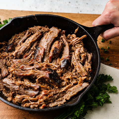 Cooked KC Shredded Brisket served in a cast-iron skillet